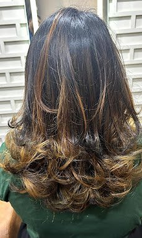 Curls with balayage highlights at Royal Look