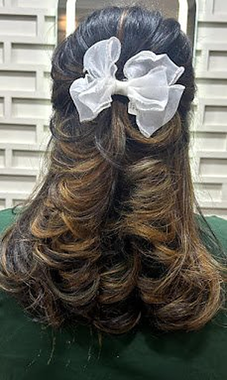 Bridal-style updo with bow at Royal Look